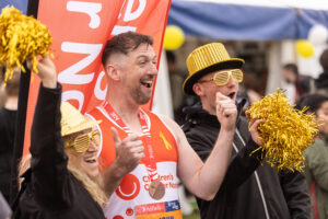 The Children's Cancer North team joining in celebrations at the finish